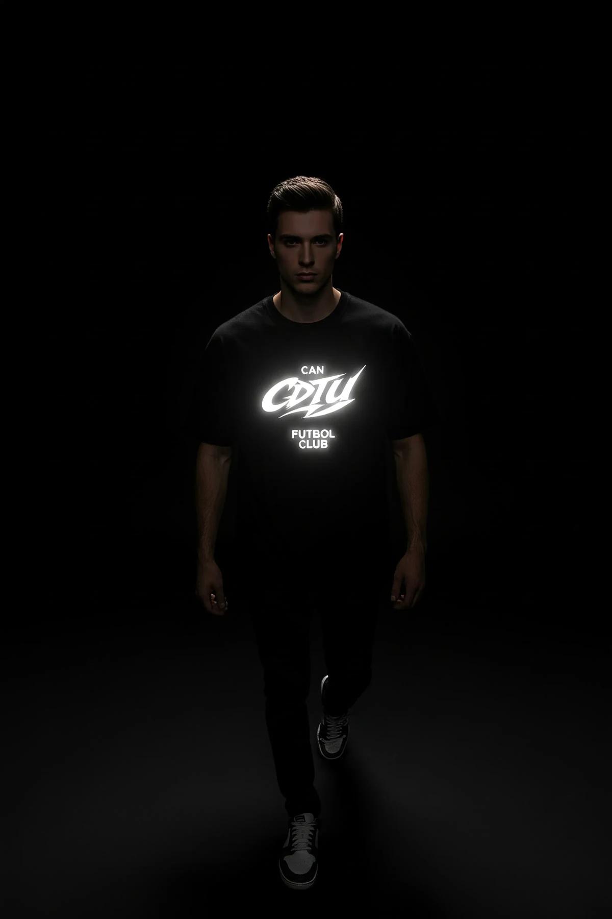 Reflective T-Shirt Black Front View Glowing Logo Print on Dark Background