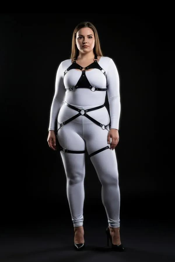 black faux leather full body harness with silver O-rings structured chest panel and thigh garters worn over white outfit
