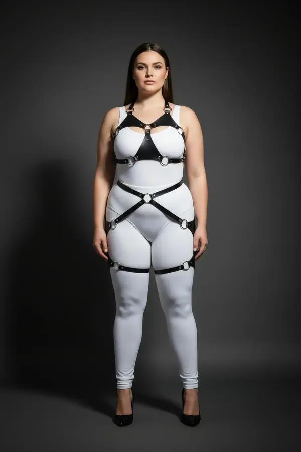 black faux leather full body harness with silver O-rings structured chest panel and thigh garters worn over white outfit