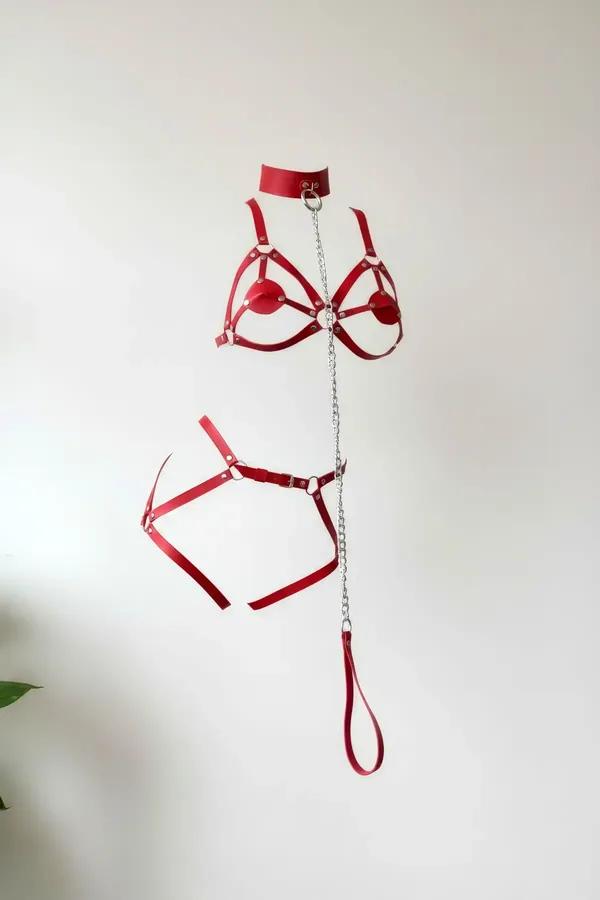 red faux leather full body harness set with choker O-ring collar silver chain leash and hip belt laid flat