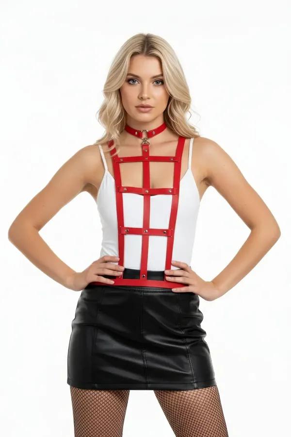 red faux leather caged body harness with choker collar and gold-tone rivet hardware worn over white bodysuit