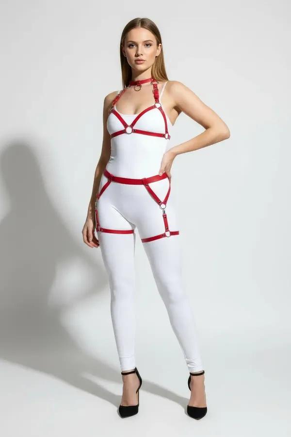 red faux leather full body harness with silver O-rings choker chest cage and thigh garters on model wearing white bodysuit