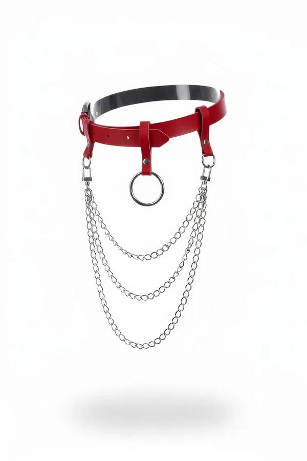 Red faux leather waist belt with central silver O-ring and three cascading silver chain tiers, white background