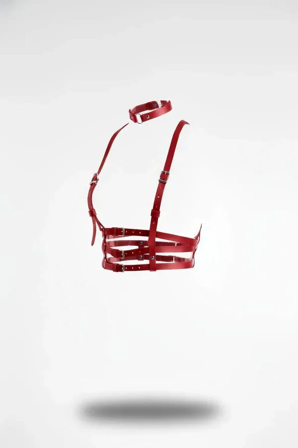 Red faux leather multi-strap underbust harness with detachable choker and silver-tone buckles, floating product shot on white