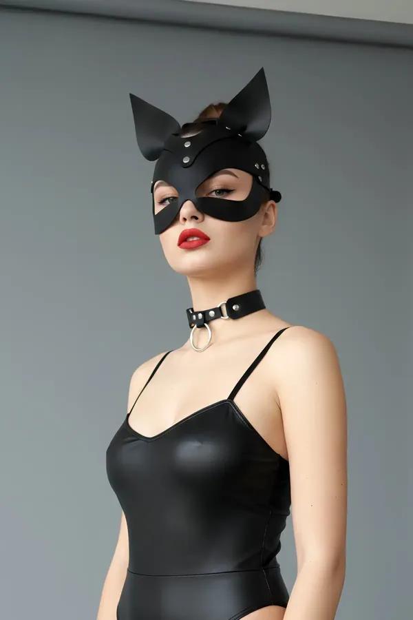 black faux leather cat mask with stand-up ears and silver studs worn with matching O-ring choker