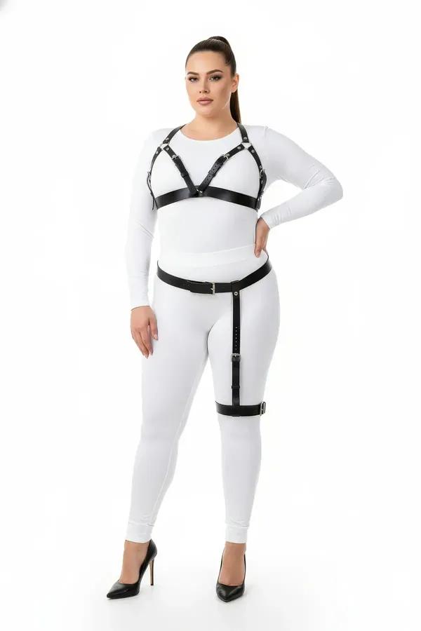 Black faux leather harness bra and thigh garter set with silver buckles worn over white outfit