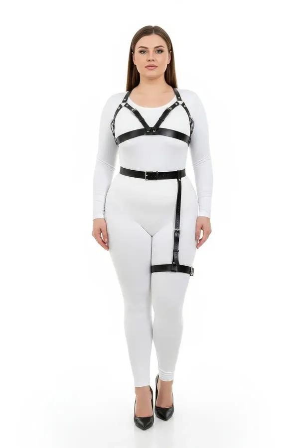 Black faux leather harness bra and thigh garter set with silver buckles worn over white outfit