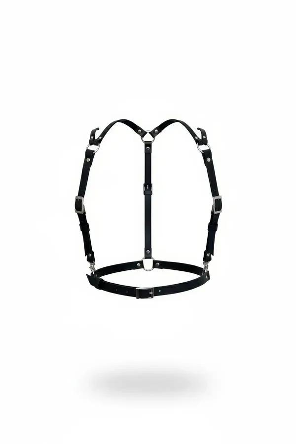 Black faux leather strappy chest harness with silver front O-ring and 8 buckle adjustment points, flat lay
