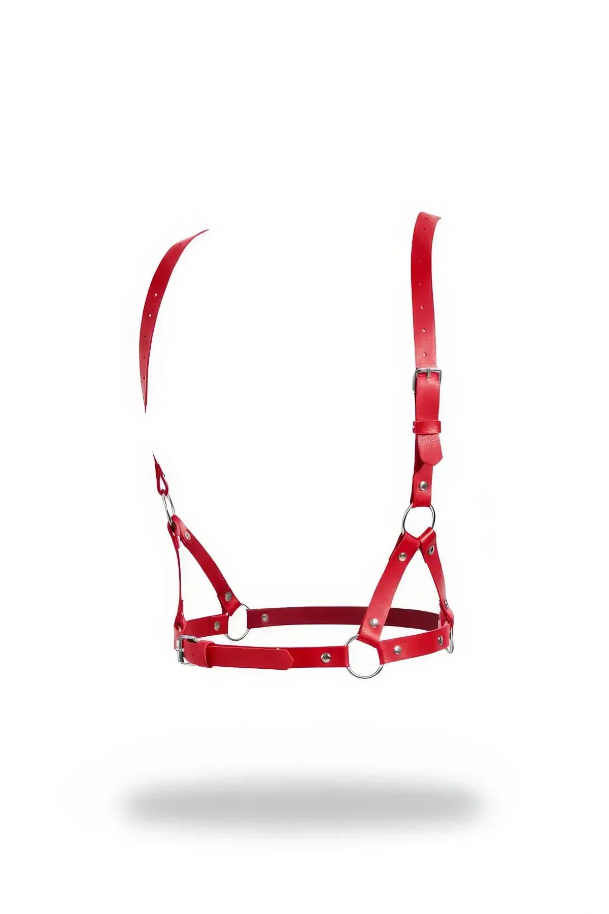 Red faux leather o-ring chest harness bra with silver buckles and cross-strap panel on white background