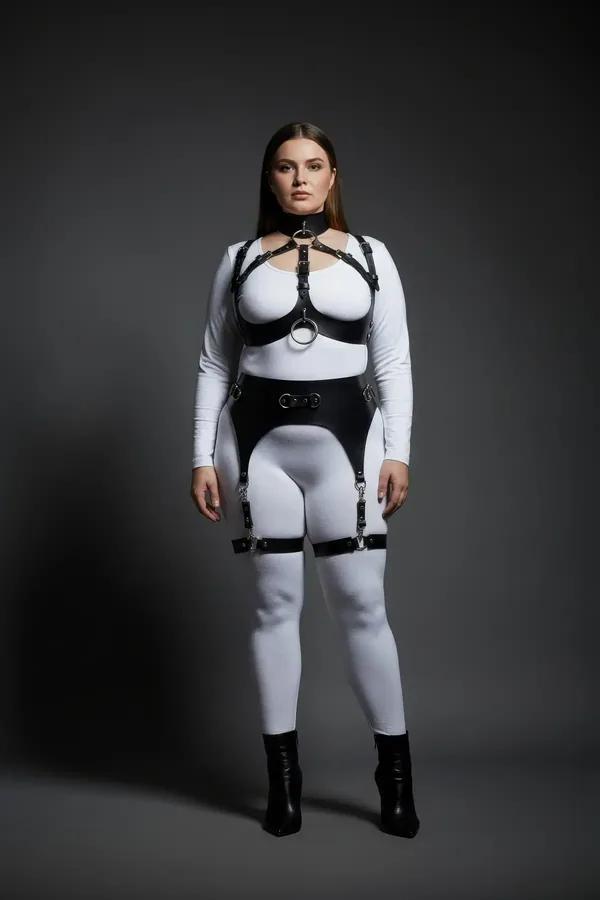 black faux leather full body harness with silver O-ring chest collar and garter thigh straps plus size model