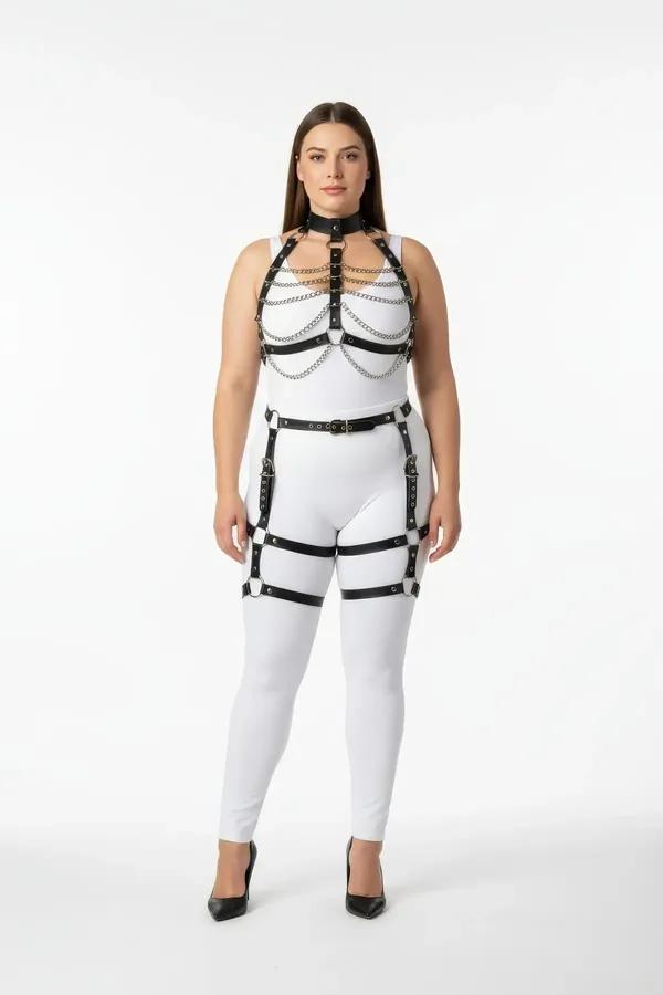 black faux leather full body harness with silver chain swags cage chest straps and thigh garter straps worn over white bodysu