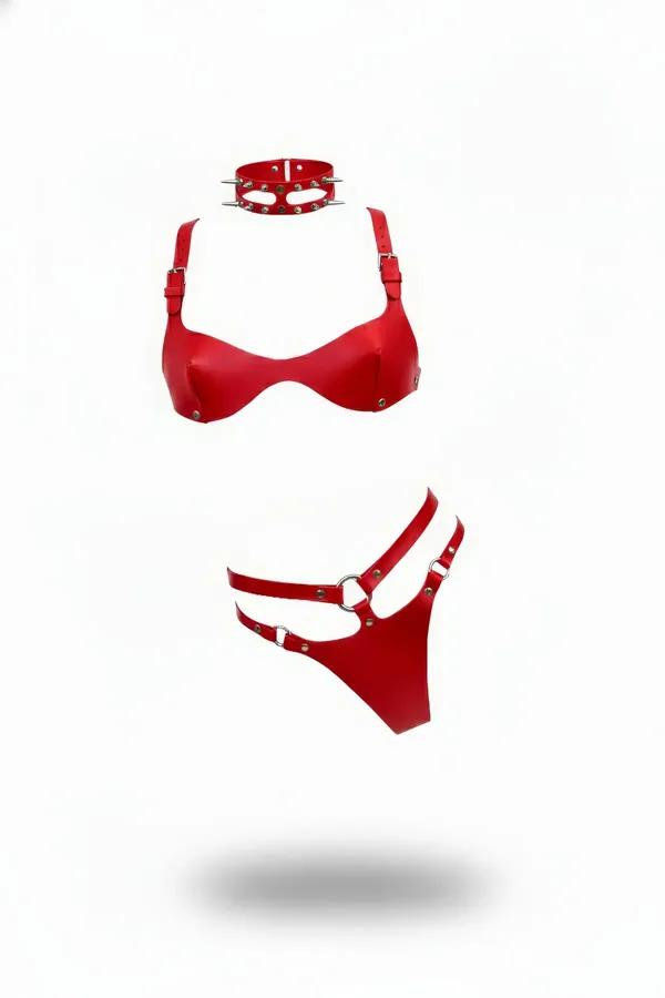 Vegan leather harness lingerie set in red featuring a buckle strap bra, double-strap G-string, and a spiked choker collar.