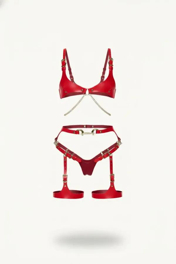 Red vegan leather harness bra and garter set with gold-toned chains and thigh cuffs.