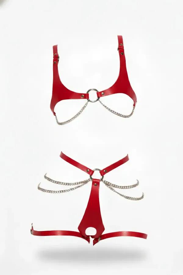 Red faux leather body harness set for women with draped silver-tone metal hip chains and central O-ring details.