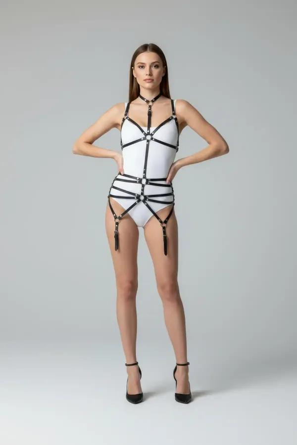 black faux leather full body harness with O-ring chest cage, three waist bands, and four detachable garter clips, front view