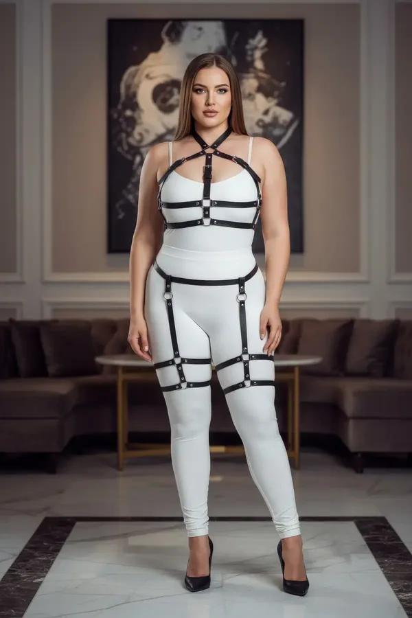 Black faux leather full body harness with garter straps, thigh bands, and silver O-ring hardware on plus-size model