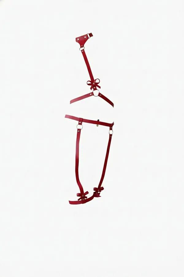 red faux leather harness set with bow accents — chest strap harness and leg garter in vivid crimson with silver O-rings
