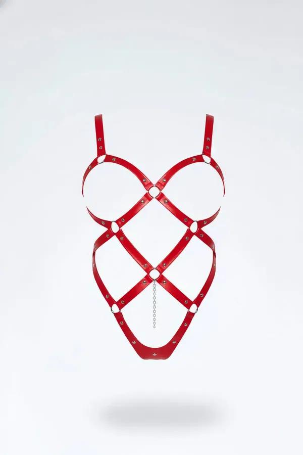 red vegan leather cage structure body harness with silver O-rings rivets and decorative chain front view