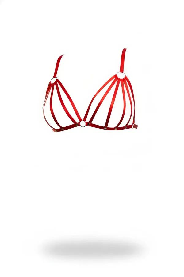 Red faux leather caged harness bra with five parallel straps per cup and silver O-ring details at shoulder and center-front