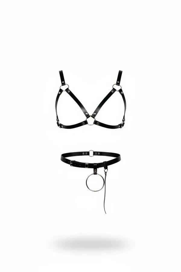 black faux leather harness bra and detachable waist belt set with silver O-ring hardware on white background