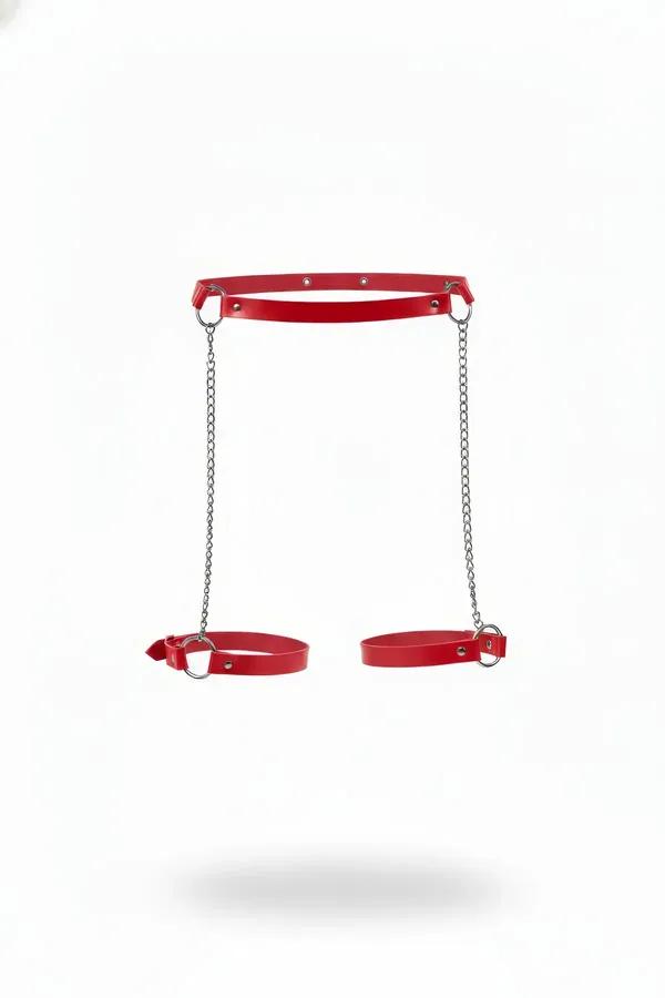 Red faux leather leg harness with dual silver garter chains and adjustable O-ring calf cuffs on white background