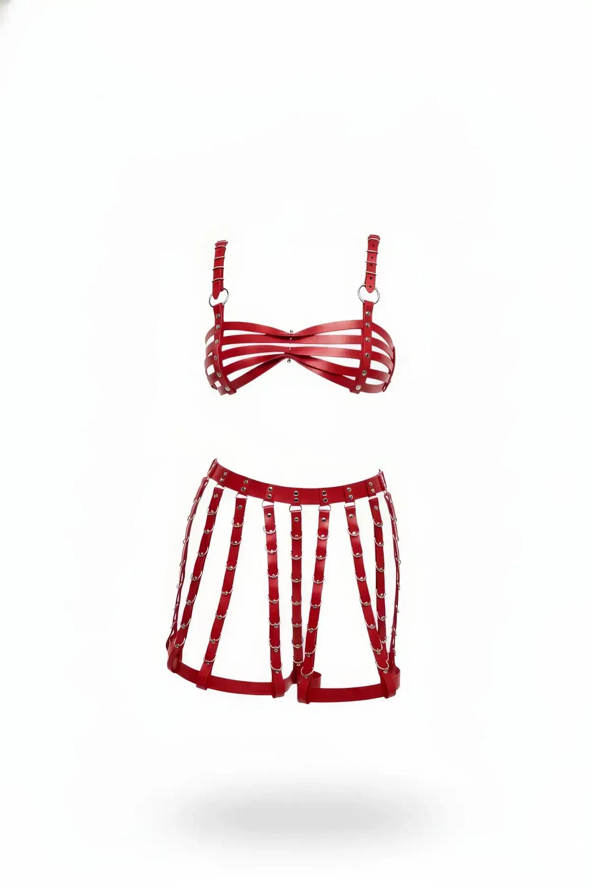 Red caged faux leather bra and harness shorts lingerie set with silver O-rings and rivets on white background