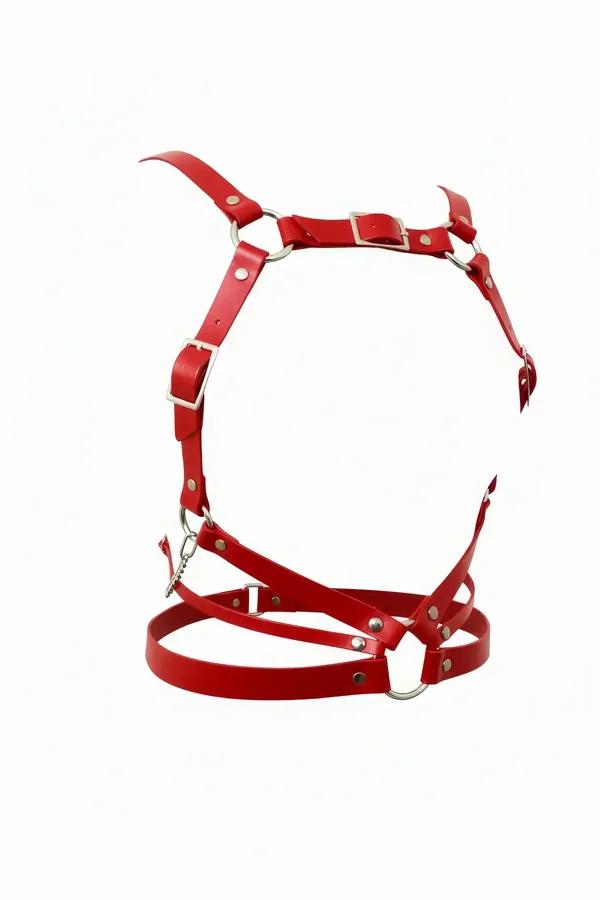 Red faux leather multi-strap body harness with silver O-rings and roller-buckle adjusters on white background