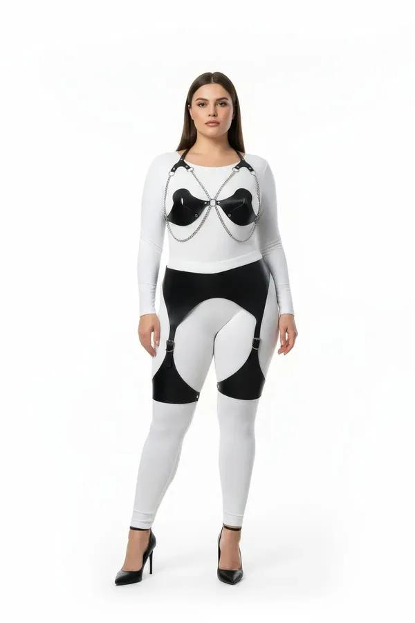 black faux leather chest harness and garter set with silver chain detail and buckle thigh straps styled over white leggings