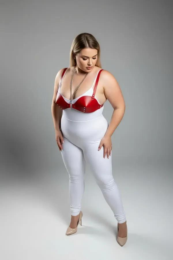 red faux leather harness bra with draped silver chain and stud trim, molded cups, front view
