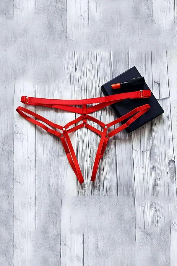 red elastic harness thong panty multi-strap geometric cut-out front gold adjustable sliders flat lay