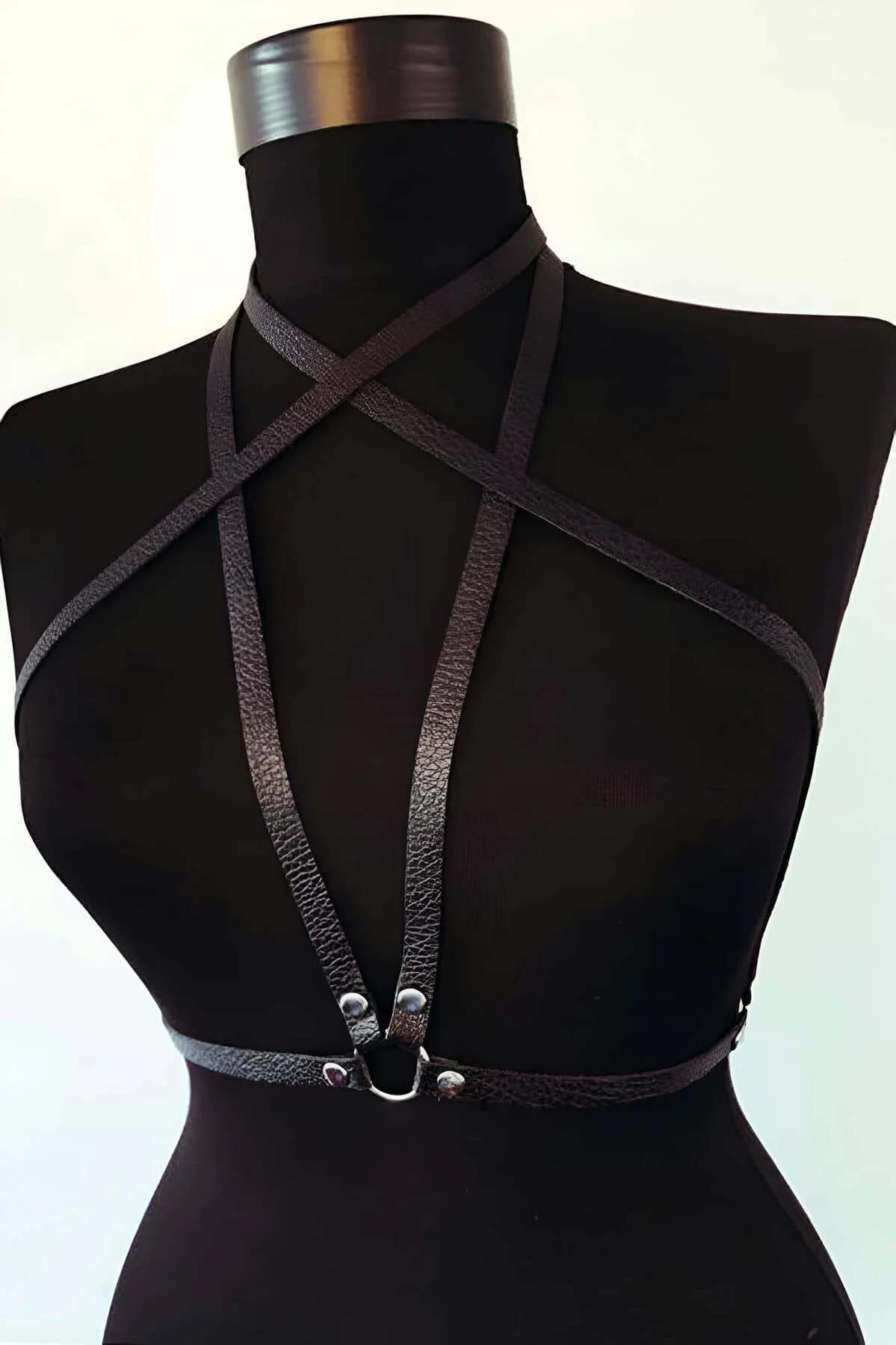 black faux leather chest harness cross-strap X design silver D-ring snap buckle front view on mannequin