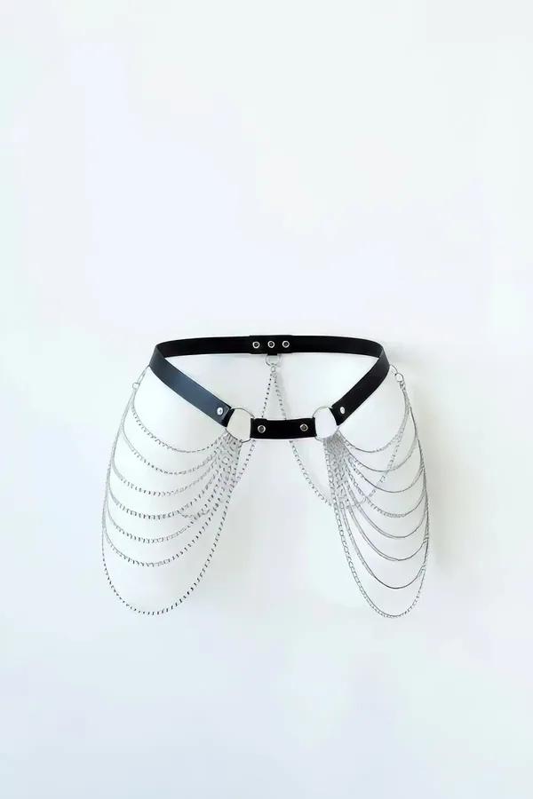 black faux leather hip harness with cascading silver rolo-link chains draping over both sides from O-ring connectors