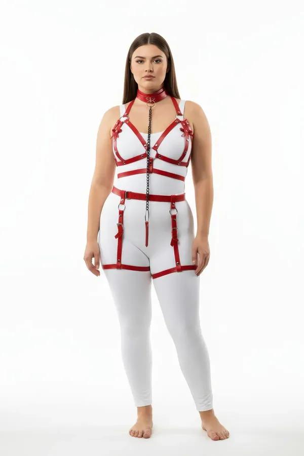 Red faux leather full body harness set with chest cage straps, front chain drop, waist belt, and adjustable thigh garters on