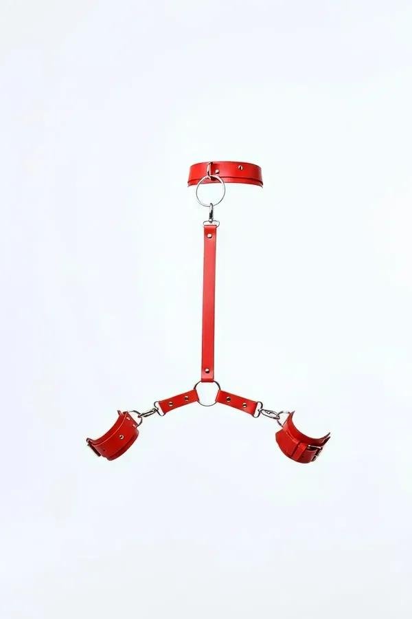 red faux leather collar and wrist cuff set with silver O-ring swivel clasp and connecting center strap, full set laid flat