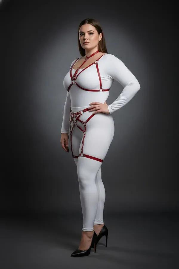 red faux leather strappy body harness set with silver O-rings chest harness waist panel and thigh garters on plus size model