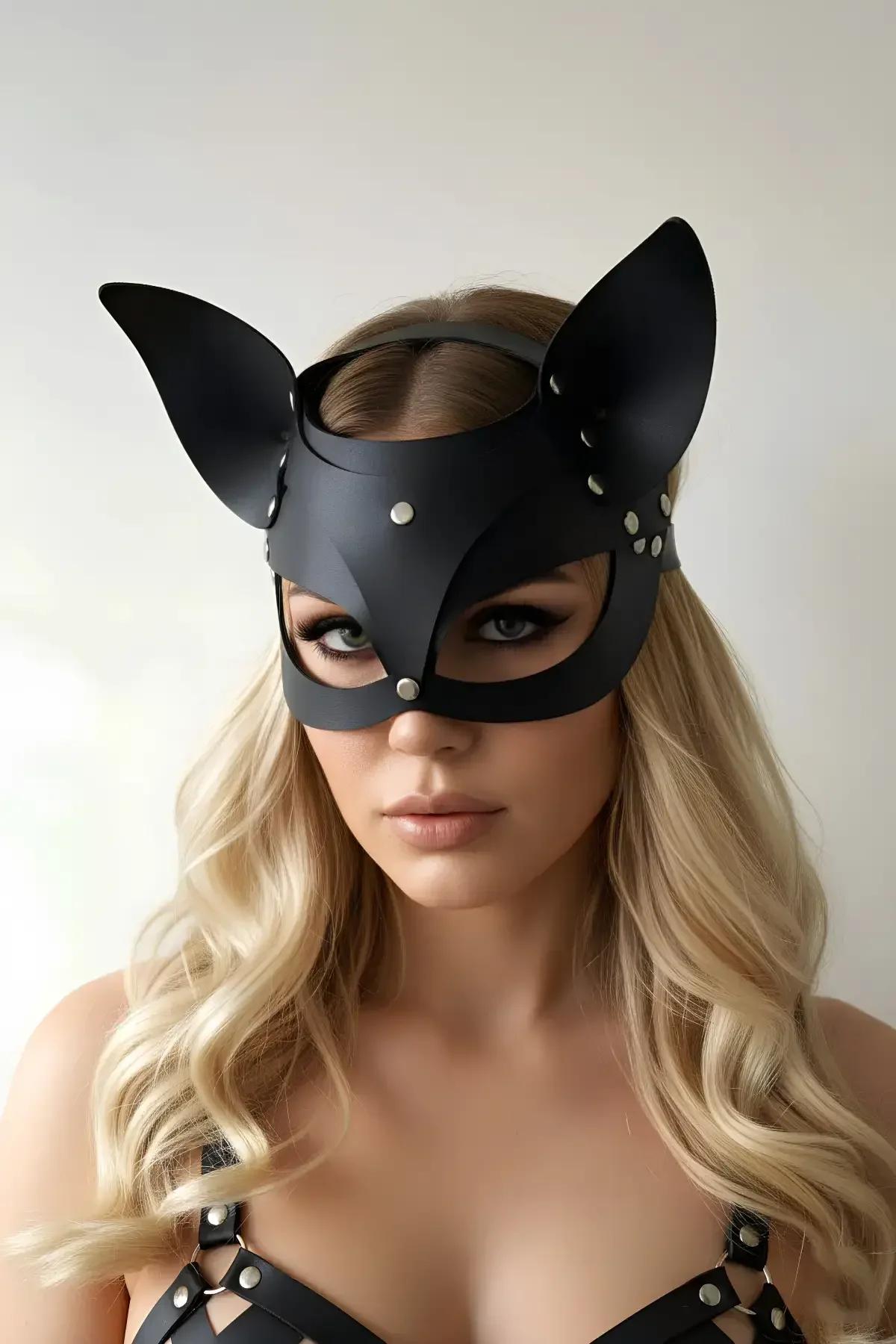 Black matte faux leather cat mask with sculpted pointed ears and silver dome studs on cheekbone panels, open eye cutouts