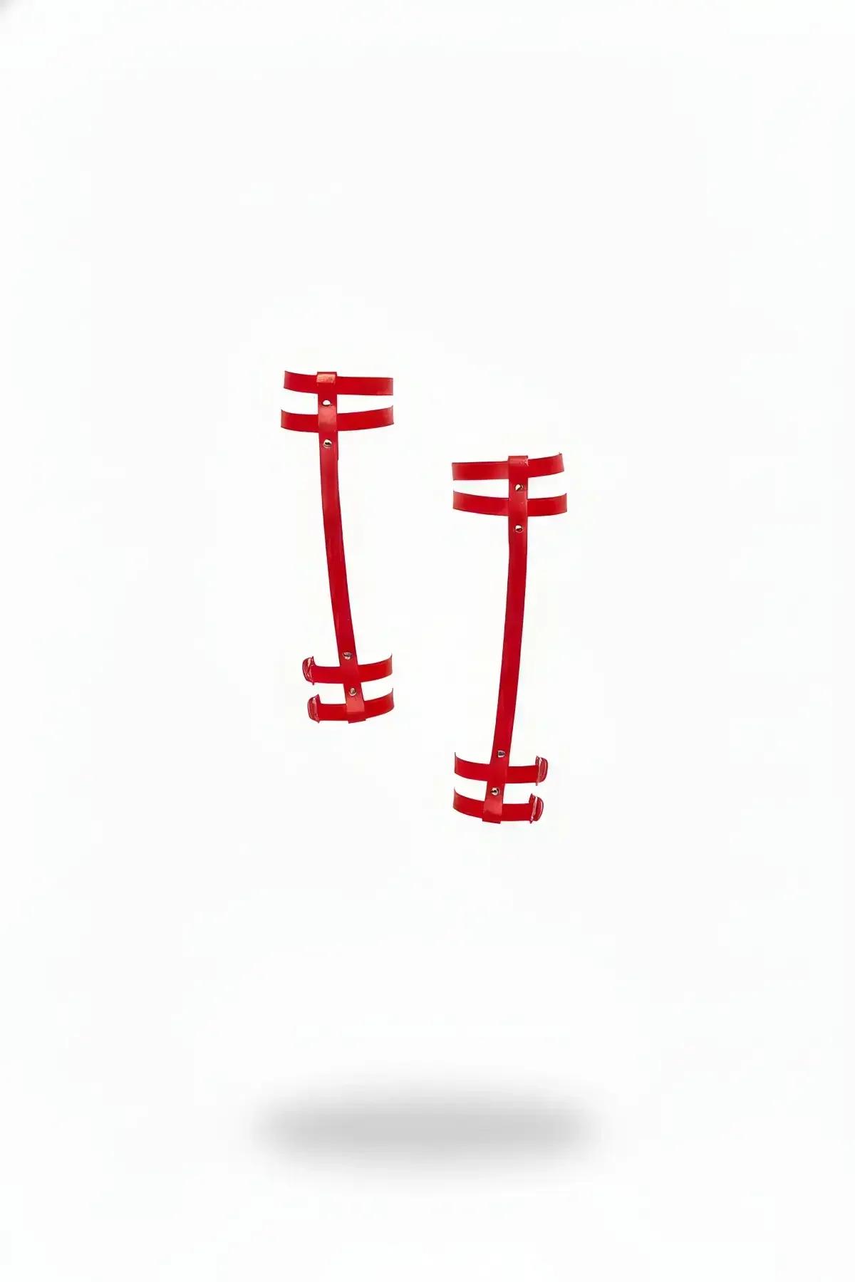 Red faux leather double-strap leg garter set pair with silver stud hardware on white background