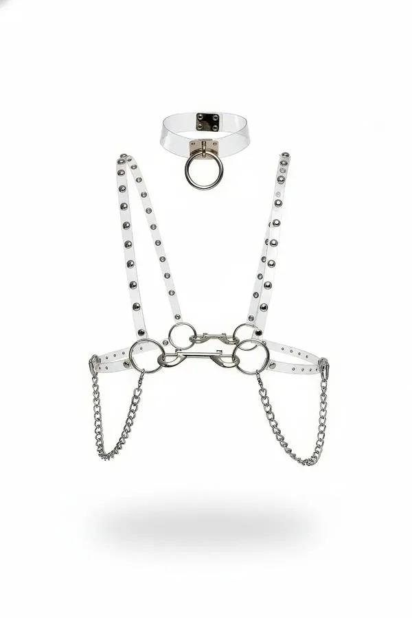 Clear PVC body harness set with silver dome studs, O-rings, and draped link chains, shown with matching choker on white backg