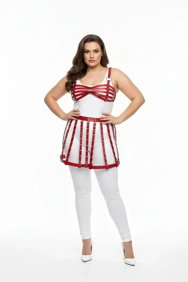 red faux leather cage skirt and bra harness set with silver O-ring and stud hardware on plus-size model