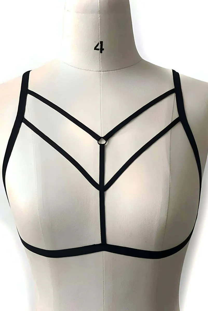 Side view of black minimalist body harness on model with O-ring detail
