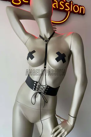 Black vegan leather lace-up corset body harness with adjustable chest strap