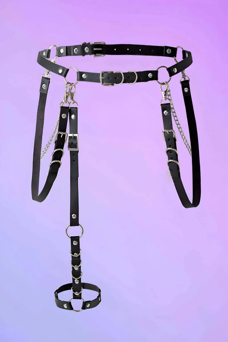 Black faux leather body harness with silver chain and O-ring leg garter detail