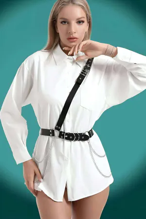 Black Faux Leather Chest Harness Belt with Triple Buckle and Chain Accents worn over white shirt