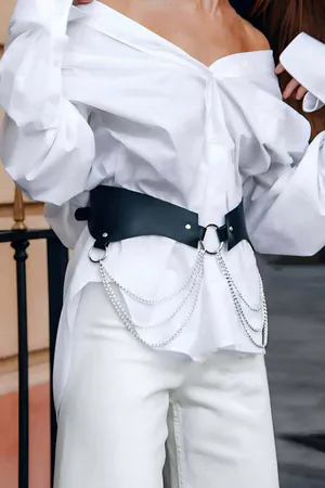 Black Faux Leather Waist Harness Belt with Silver O-Ring and Draped Chains over White Shirt