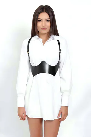 Black Faux Leather Underbust Harness for Women Styled over White Shirt Dress
