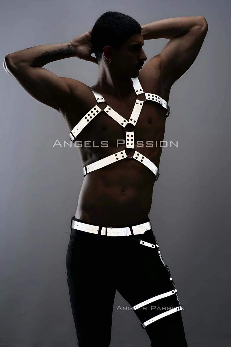Reflective leg harness straps close-up view black pants with white reflective detail