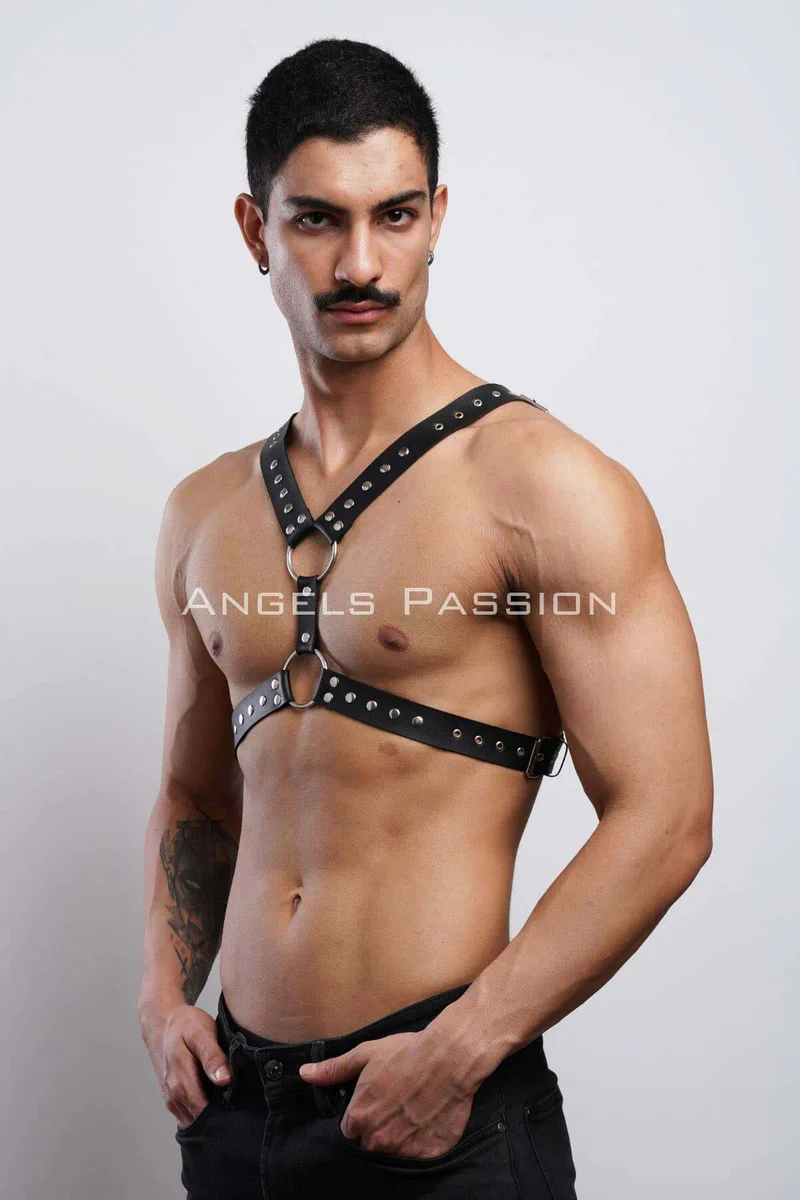 Black leather studded chest harness with O-ring accents detailed