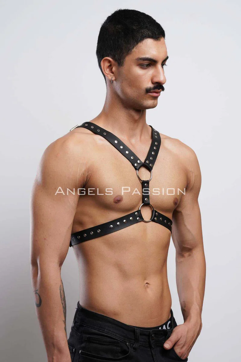 Black studded chest harness O-ring accents side profile strap configuration