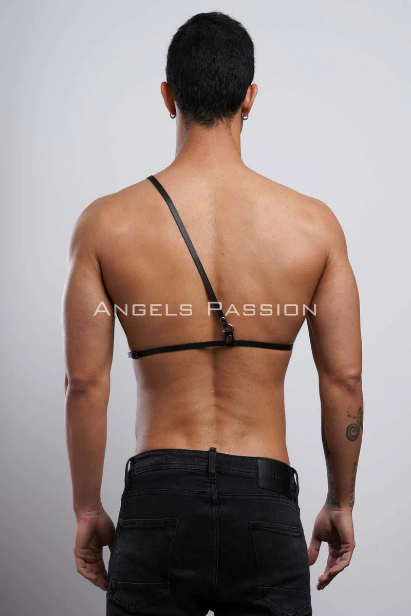 Black faux leather chest harness with adjustable O-ring strap detail