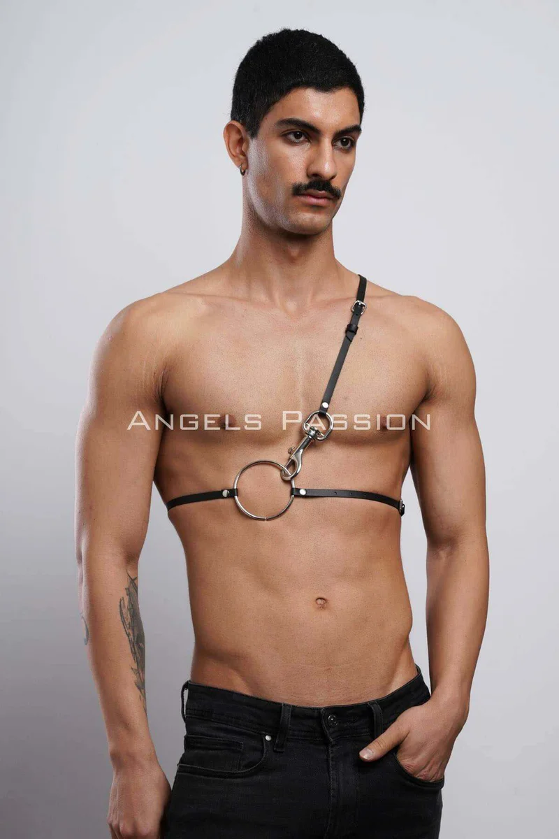 Black o-ring chest harness featuring a single shoulder strap and adjustable buckles